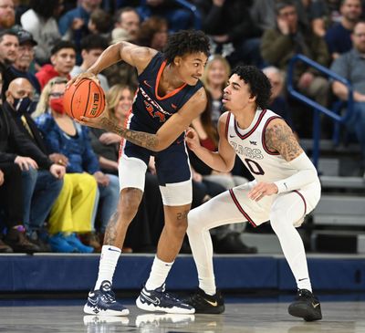 Gonzaga’s Julian Strawther guards Pepperdine’s Maxwell Lewis during Saturday’s West Coast Conference opener at McCarthey Athletic Center.  (Jesse Tinsley / The Spokesman-Review)