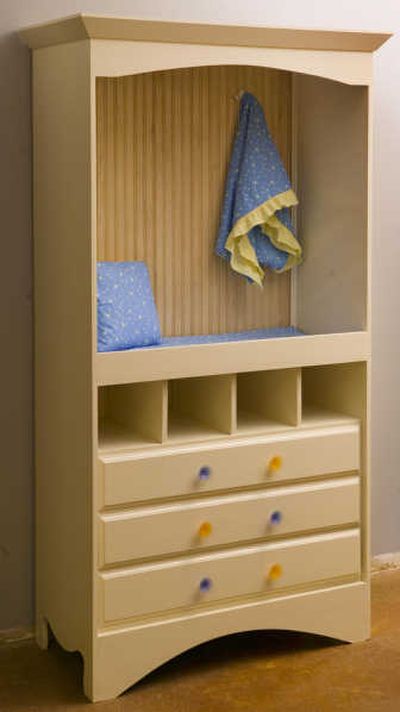 
April Welsh, interior design student at Johnson County Community College in Kansas City, Mo., turned this TV armoire into a more modern changing table. Kansas City Star
 (Kansas City Star / The Spokesman-Review)