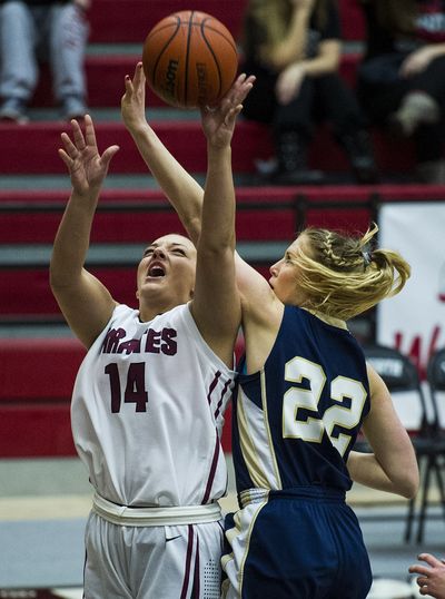 Whitworth’s Callie Harwood, left, is fouled by Whitman’s Heather Lovelace during first-half action Tuesday. (Colin Mulvany)