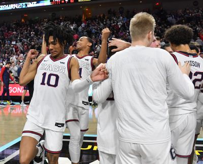 Gonzaga guards Hunter Sallis (10) and Nolan Hickman (11) celebrate after defeating the St. Mary’s Gaels in the WCC title game in Las Vegas.  (Tyler Tjomsland/The Spokesman-Review)