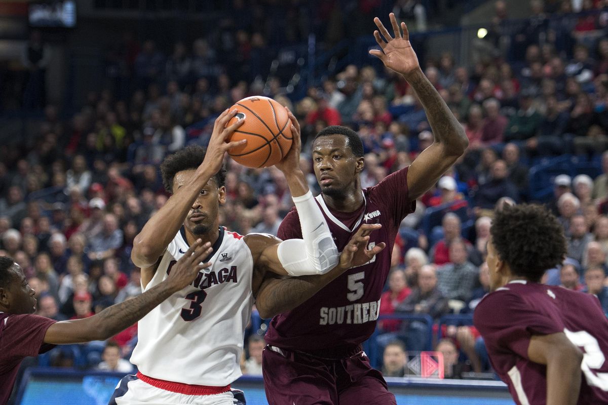 Former Gonzaga forward Johnathan Williams  drives into the key against Texas Southern’s Trayvon Reed  during last year’s game at the McCarthey Athletic Center. (Colin Mulvany / The Spokesman-Review)