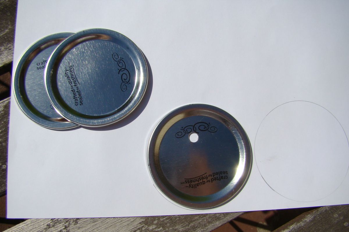 Drill holes in spent canning lids, and trace them on decorative paper. (Maggie Bullock)