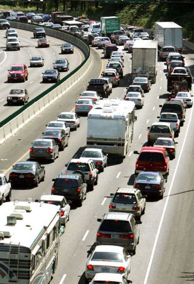 
Traffic leaving Portland. The Supreme Court will hear a global warming case that calls for regulation of exhaust fumes.  
 (File Associated Press / The Spokesman-Review)