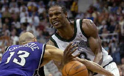 
Kings' Doug Christie (13) strips the ball from Latrell Sprewell.
 (Associated Press / The Spokesman-Review)