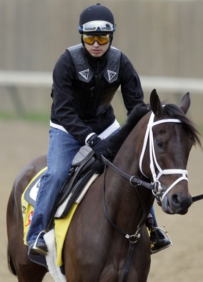 Exercise rider Hector Ramos takes Uncle Mo for a workout on Wednesday. (Associated Press)