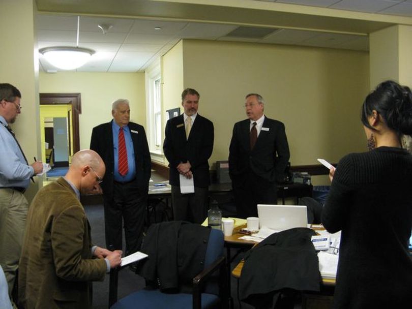 Senate Commerce Chairman John Andreason, R-Boise, left, and Senate Assistant Majority Leader Joe Stegner, R-Lewiston, right, brief reporters along with Senate GOP spokesman Phil Hardy, center, about the decision Tuesday morning to cancel a scheduled 1:30 hearing on HCR 42, a bill to block a COLA for state retirees. The cancellation means the bill is dead, and retirees will get their scheduled 1 percent COLA. (Betsy Russell)