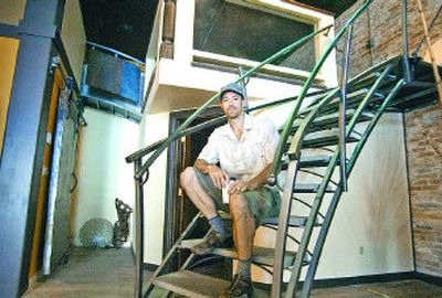 
Exposed brick and eclectic art make Matt Roberts' condo quite the pad. Roberts is converting 2,300 square feet in the Oakley building downtown. 
 (Christopher Anderson / The Spokesman-Review)