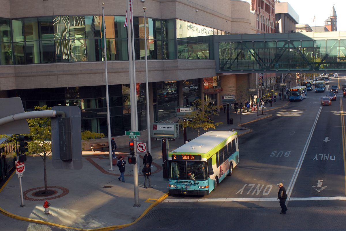 Riders board buses at the Spokane Transit Authority Plaza in downtown Spokane. (Jesse Tinsley / The Spokesman-Review)