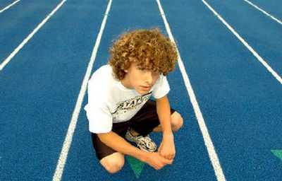 
Michael Armon, the defending State 5A cross country champion in Idaho, injured his knee in a non-running accident.
 (File/ / The Spokesman-Review)