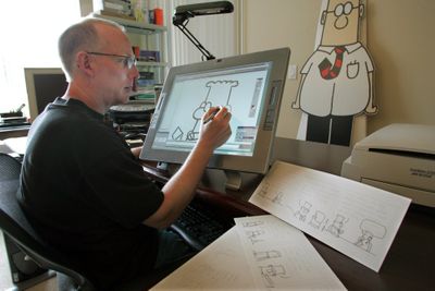 As “Dilbert,” created by Scott Adams, celebrates its 20th anniversary, it’s riding a resurgence thanks to corporate America’s economic woes. In February, the comic strip’s Web site logged 1.5 million visitors, one of its busiest months ever. Adams, right, works in his home in Dublin, Calif.The Washington Post (File The Washington Post / The Spokesman-Review)