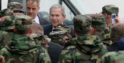 
President Bush greets Air Force personnel Thursday after landing at Wright- Patterson Air Force Base in Dayton, Ohio. The president later spoke at the nearby National Museum of the U.S. Air Force. Associated Press
 (Associated Press / The Spokesman-Review)