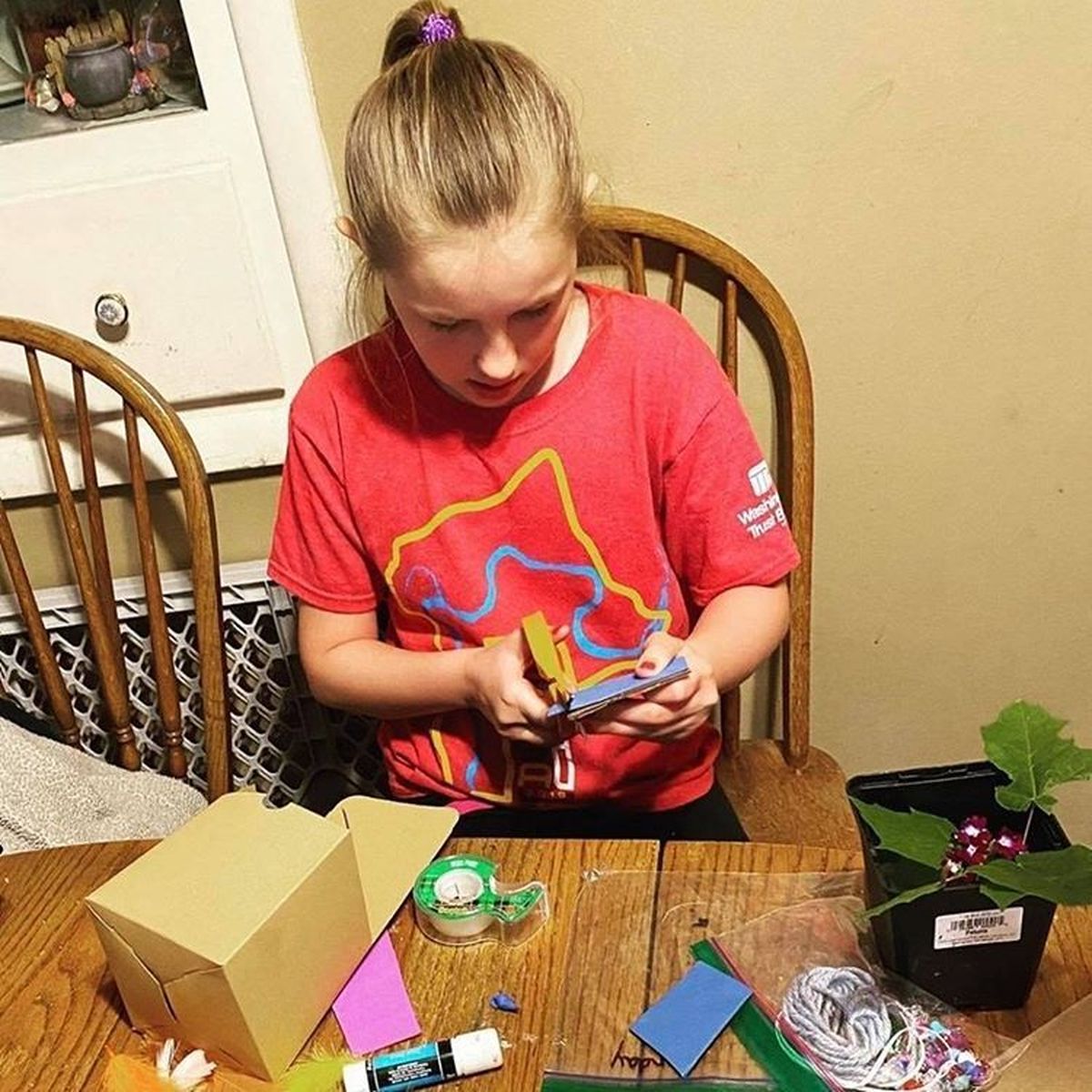 Mylee Nelson works on an activity kit she requested through the Spokane County Library District’s Camp Read-a-rama. Families can call the district to reserve a kit for pick  (Courtesy of SCLD)