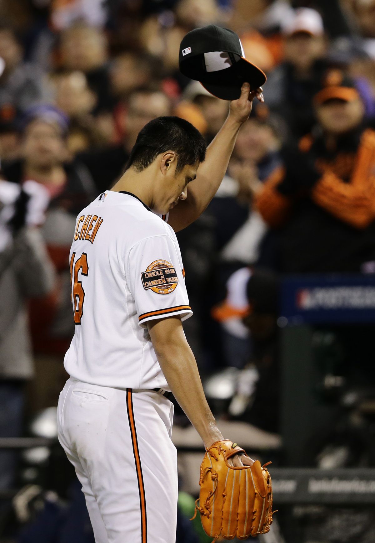 Orioles starting pitcher Wei-Yin Chen acknowledges fans as he was relieved in the seventh inning. (Associated Press)