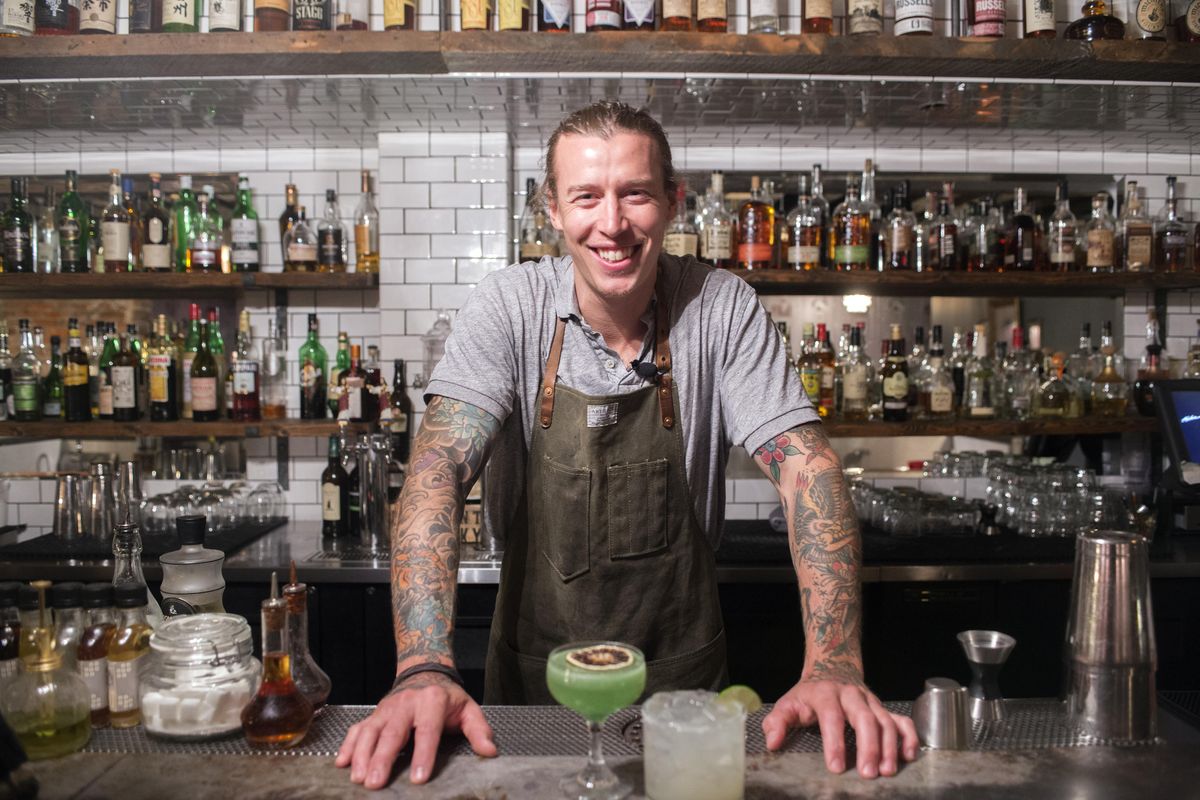 Ben Poffenroth of Durkin’s Liquor Bar stands behind the basement bar. (Jesse Tinsley / The Spokesman-Review)