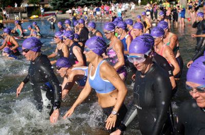 
Participants take off for the opening swim of last year's Valley Girl Triathlon   in Liberty Lake. This is the third year for the event. 
 (Liz Kishimoto / The Spokesman-Review)