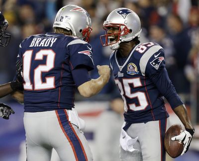 Tom Brady celebrates his 37-yard TD to Brandon Lloyd in the first quarter. (Associated Press)