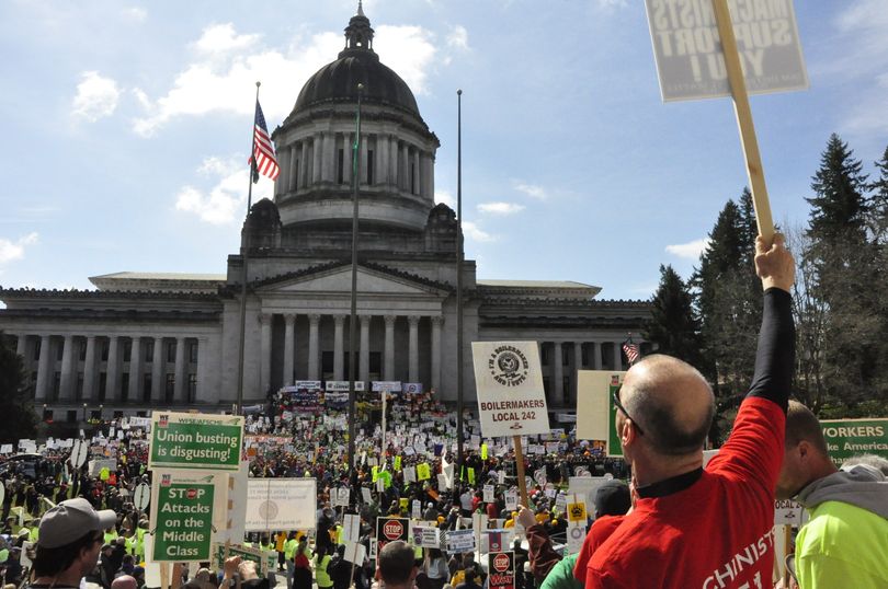 Some 7,000 protesters crowd the Capitol campus Friday to ask the Legislature to eliminate some tax exemptions rather than pass an 