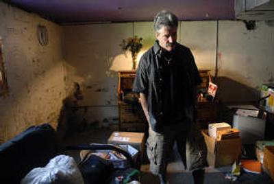 
Ken Zigler stands among the belongings of his son Tim, who  died last year  of a methadone overdose. 
 (Holly Pickett / The Spokesman-Review)