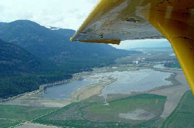 
Flanked by the Selkirk Mountains and the Kootenai River, a 500-acre wetlands area on Ball Creek Ranch is filling with water for the first time since it was shaped by Ducks Unlimited in 2002.  
 (Photo by Ivan Lines / The Spokesman-Review)