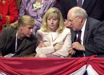 
Dick Cheney confers with daughters Mary, left, and Elizabeth after arriving at the Republican National Convention in Philadelphia in July 2000. 
 (Associated Press / The Spokesman-Review)