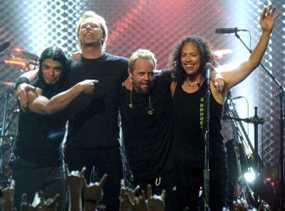 
Robert Trujillo, James Hetfield, Lars Ulrich and Kirk Hammett of Metallica take a bow following their performance at the close of 
