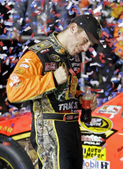 Jamie McMurray celebrates in victory lane after winning at Charlotte Motor Speedway.  (Associated Press)