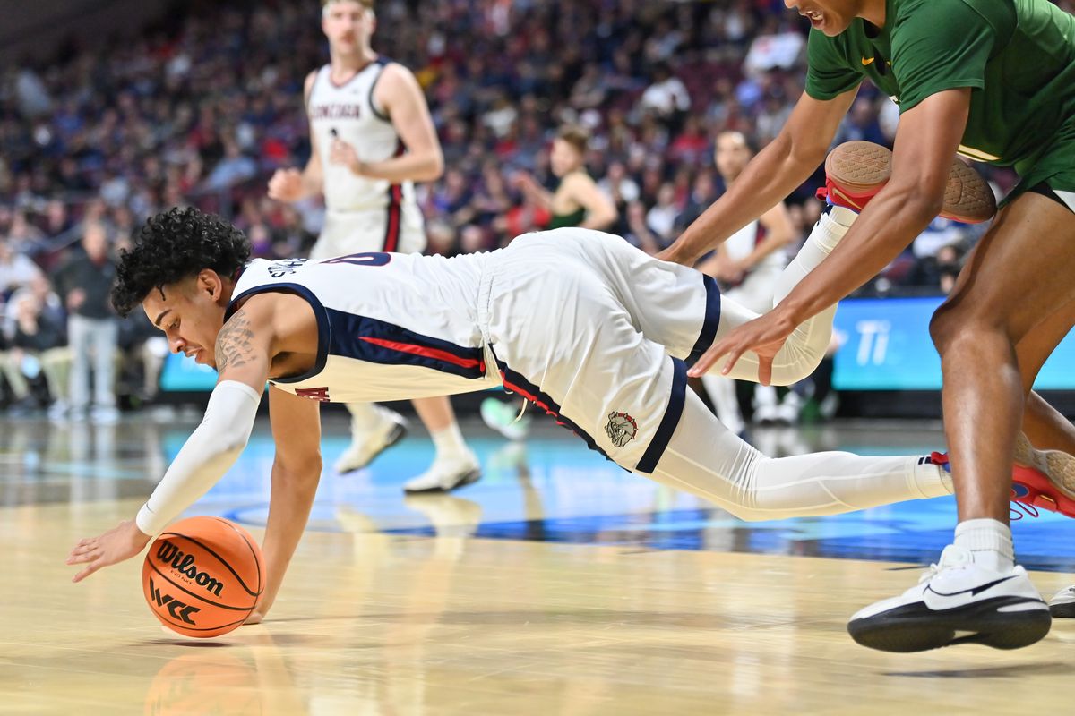 Gonzaga Bulldogs guard Julian Strawther (0) dives for a loose ball against the San Francisco Dons during the first half of the WCC Men’s Semifinal basketball game on Monday Mar 7, 2022, in Las Vegas, Nev.  (Tyler Tjomsland/The Spokesman-Review)