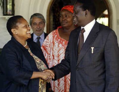 
Kenyan opposition leader Raila Odinga shakes hands with the top U.S. envoy for Africa, Jendayi Frazer, after their meeting Monday in Naiirobi. Associated Press
 (Associated Press / The Spokesman-Review)