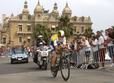 Seven-time Tour de France winner Lance Armstrong strains as he passes Monaco’s Casino during the Tour de France’s first stage. (Associated Press / The Spokesman-Review)