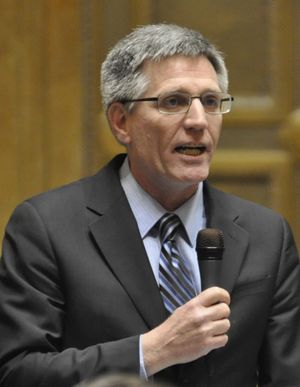 OLYMPIA -- Rep. Timm Ormsby, D-Spokane, introduces the Sheena Henderson Bill for a vote in the House on Wednesday, April 8. It would require police to notify family members before returning a firearm that has been seized from someone for domestic violence or mental health issues. It passed unanimously. (Jim Camden)