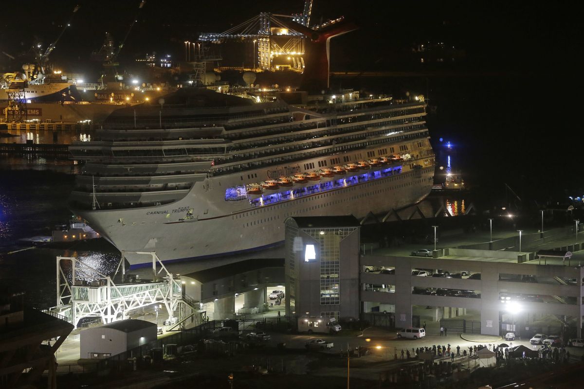 The cruise ship Carnival Triumph is pushed toward the cruise terminal along the Mobile River in Mobile, Ala., Thursday. (Associated Press)