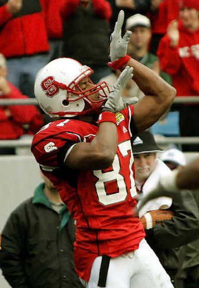 
North Carolina State receiver Brian Clark celebrates a touchdown catch.  
 (Associated Press / The Spokesman-Review)