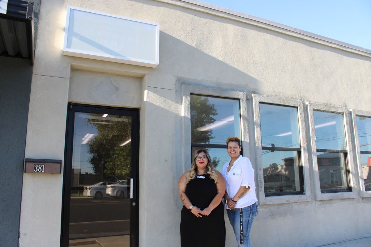 Maria Martinez, right, site manager for a community center office in Othello, is pictured outside the location on 381 E. Main St., alongside Sulema Martinez, the business and community outreach navigator.  (Monica Carrillo-Casas/The Spokesman-Review)