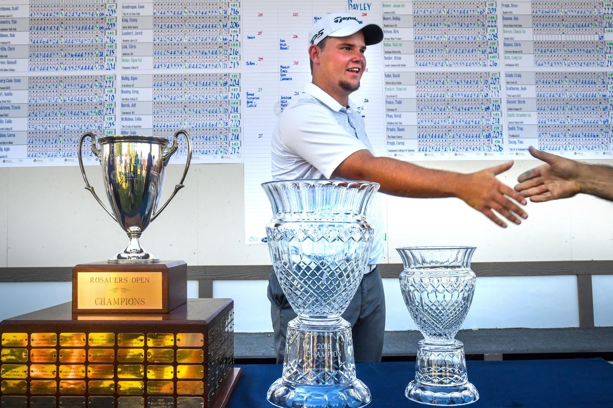 Derek Bayley took home all the hardware Sunday after winning the Rosauers Open. He was low amateur, overall champion and also gets his name on the permanent trophy. (Dan Pelle / The Spokesman-Review)