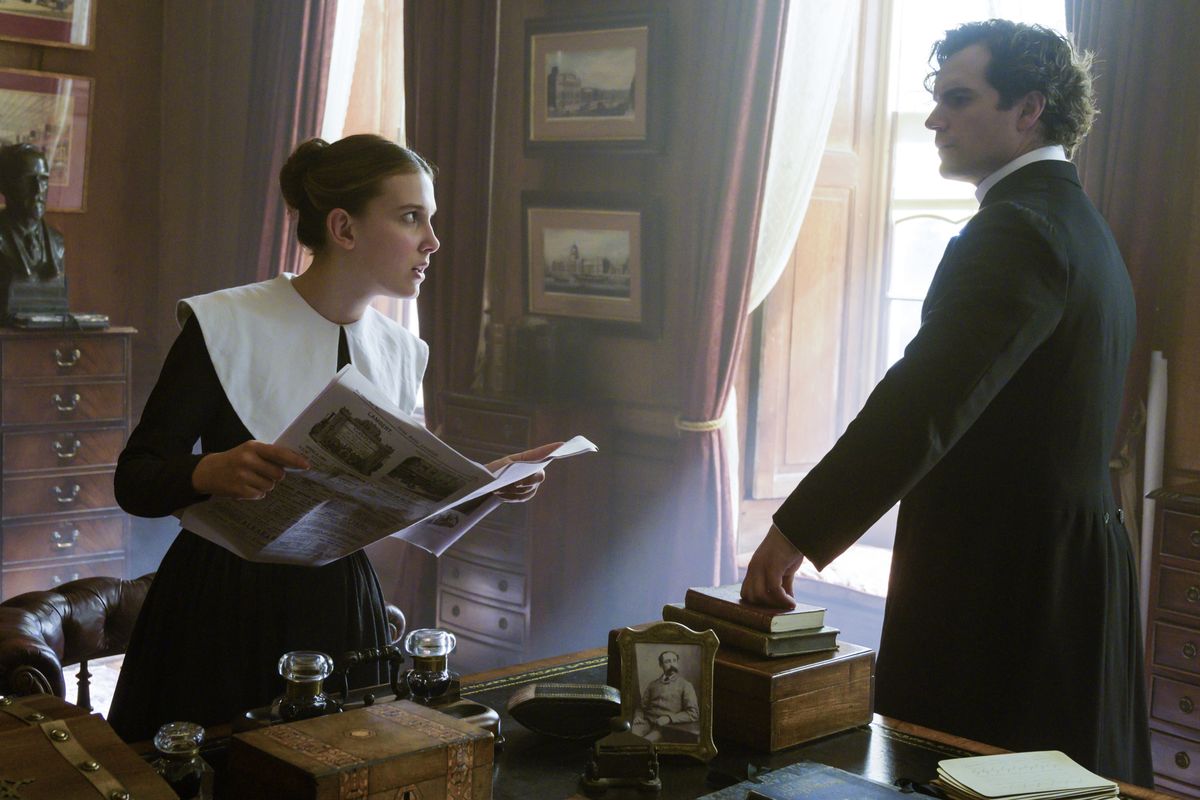 Millie Bobby Brown and Henry Cavill in “Enola Holmes.”  (Alex Bailey/Netflix)