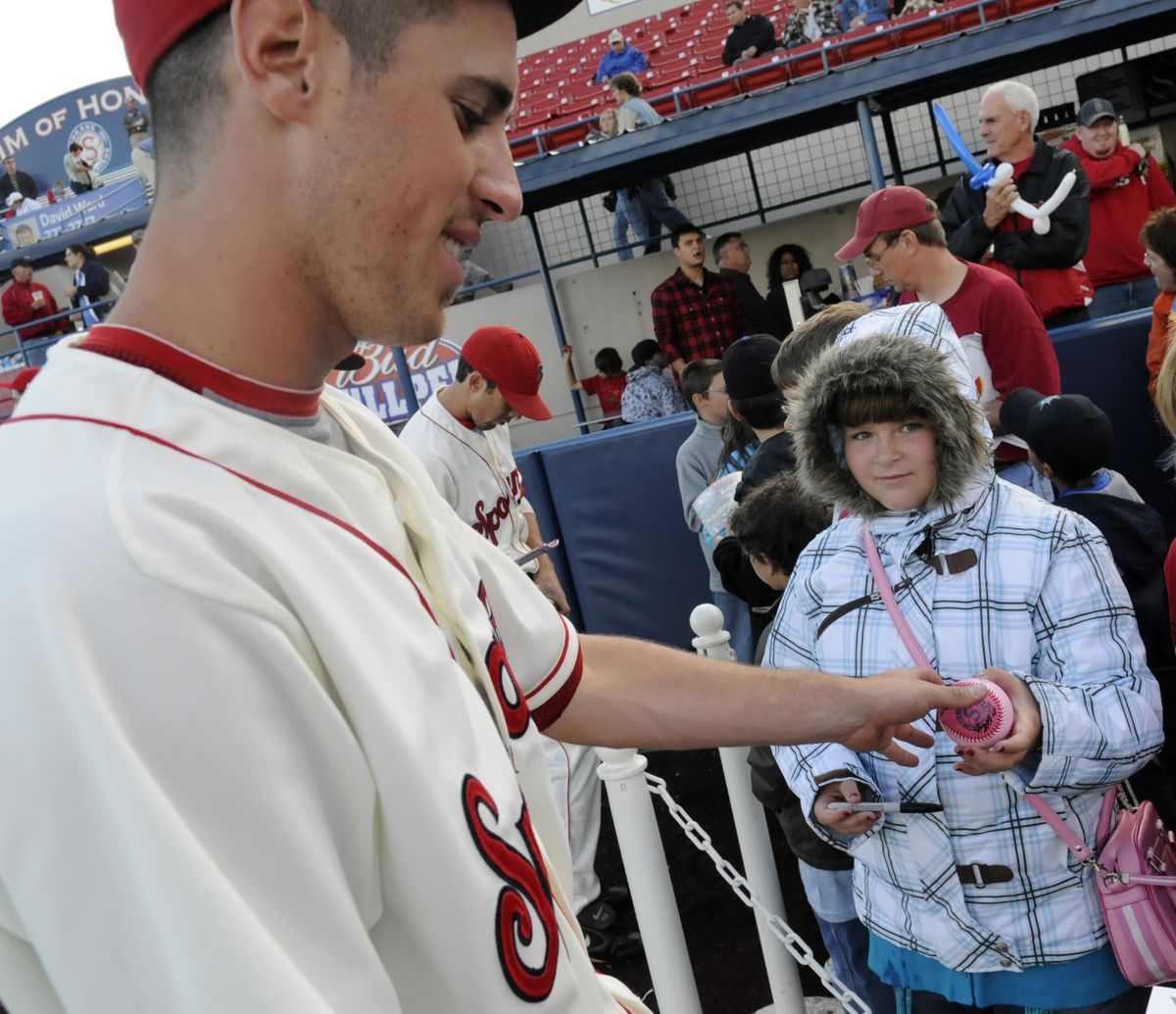 Cortany St. Clair of Spokane Valley has her ball autographed by Indians first baseman Jared Prince.bartr@spokesman.com (J. BART RAYNIAK photos / The Spokesman-Review)