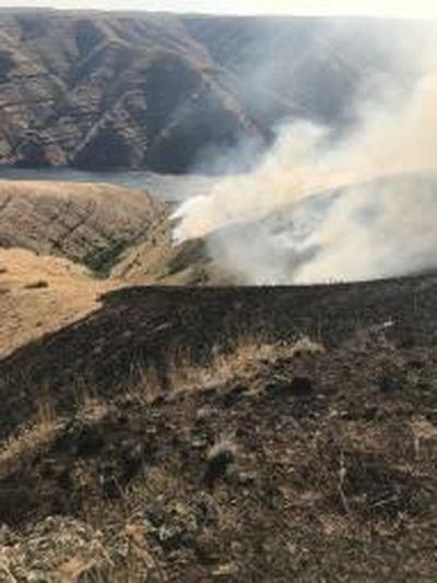 The Snake River wildfire started by lightning early Saturday morning was 20 percent contained as of Monday. (Washington Department of Natural Resources / Courtesy photo)