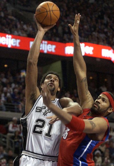 
San Antonio's Tim Duncan takes a shot over the defense of Detroit's Rasheed Wallace during the second half.
 (Associated Press / The Spokesman-Review)