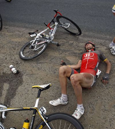 Lance Armstrong and  teammate Jose Luis Rubiera Vigil, on the ground, were involved in a crash at the Tour of California. (Associated Press)