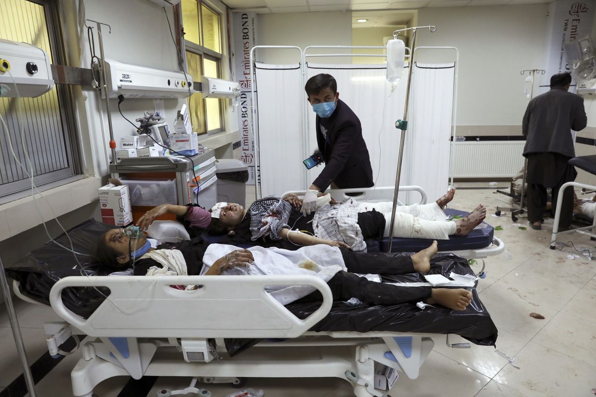 Afghan school students are treated at a hospital after a bomb explosion near a school in west of Kabul, Afghanistan, Saturday, May 8, 2021. A bomb exploded near a school in west Kabul on Saturday, killing several, many them young students, Afghan government spokesmen said.  (Rahmat Gul)