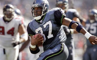 
Shaun Alexander's boom-or-bust style keeps Seattle fans, coaches guessing. 
 (Associated Press / The Spokesman-Review)