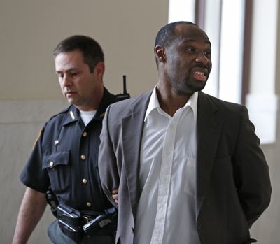 Ricardo Woods is taken from court after he was found guilty in the death of David Chandler. (Associated Press)