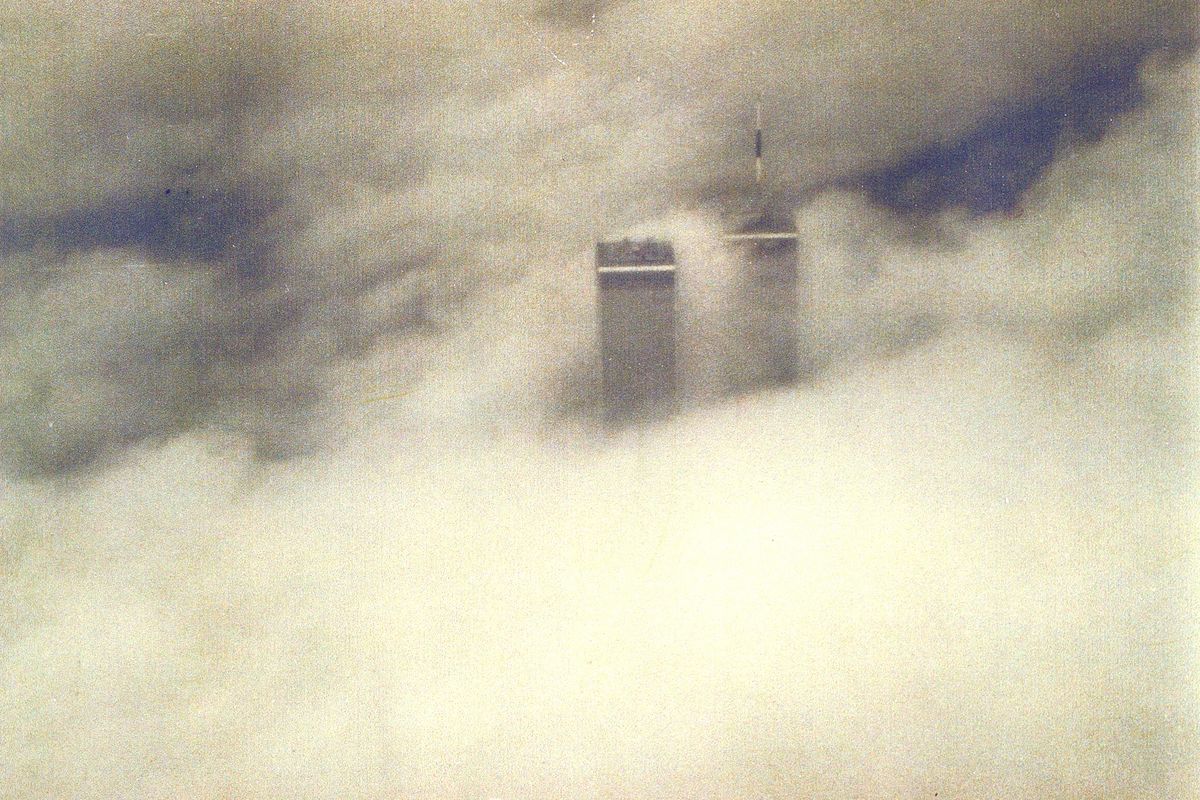 John Conley, owner of the White Elephant stores in Spokane, grew up in New York City and has had a long tradition of taking family and friends to visit his hometown. Conley took this photo from the airplane on Sept. 11, 2000, exactly one year before the twin towers collapsed during the terrorist attack. “There were just these 20 top stories peeking out of the cloud,” Conley said.