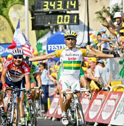 
Robbie McEwen of Australia, right, crosses the finish line to win the 13th stage of the Tour de France.
 (Associated Press / The Spokesman-Review)