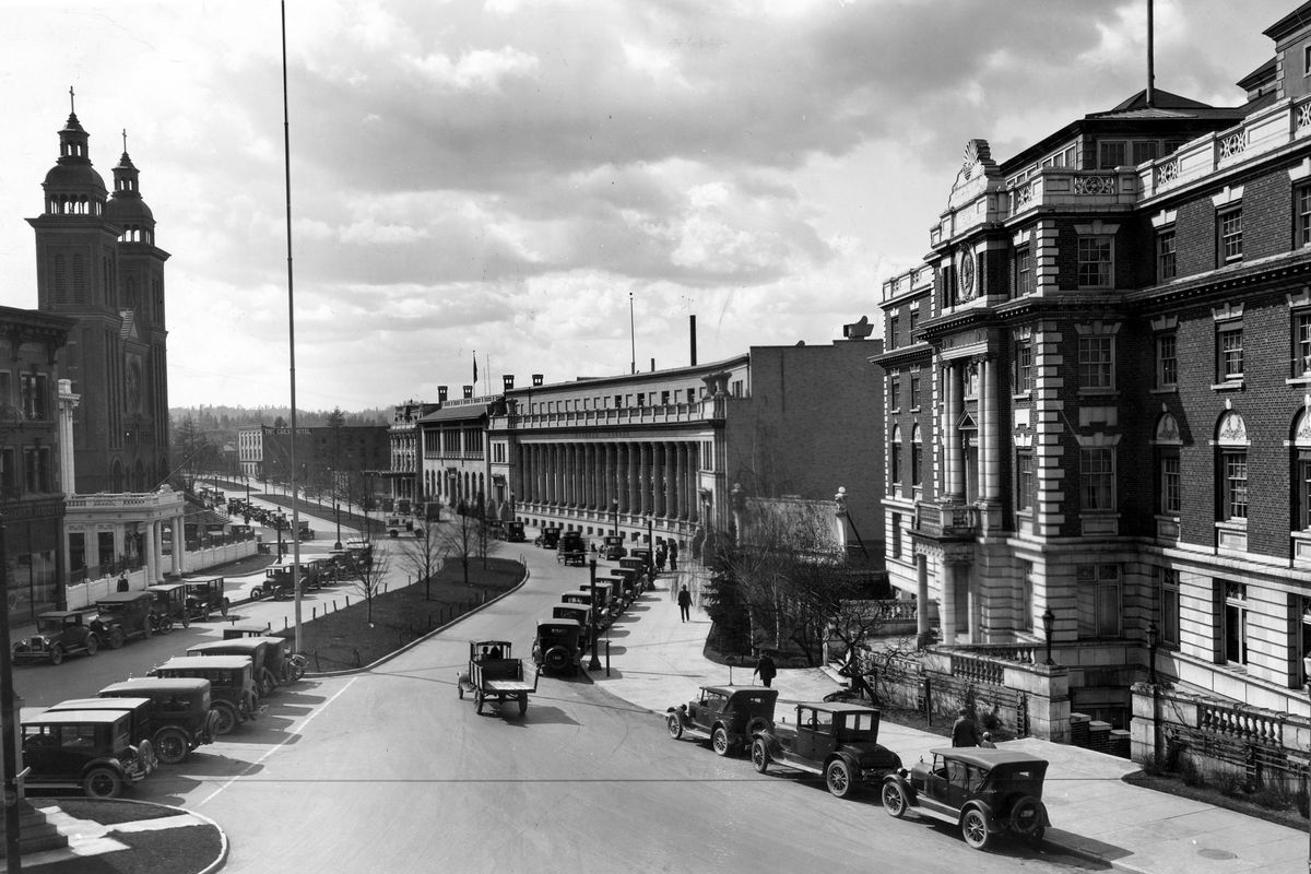 June 5, 1928: This view shows Spokane’s civic center, the stretch of Riverside Avenue where clubs, churches and lodges were built. On the left side of the street you can see the Touraine Hotel annex, the Western Union Life building and the Cathedral of Our Lady of Lourdes. On the right, nearest to farthest, are the Spokane Club, an empty lot (future site of the Chamber of Commerce building), the Masonic Temple, the Elks Lodge and the Smith and Co. building.