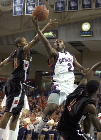 Gonzaga's Jeremy Pargo slices through the defense of Cal State Northridge's Rob Haynes, left, and Jonathan Heard.
(Dan Pelle / The Spokesman-Review)