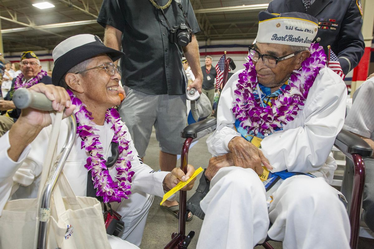 In this Dec. 7, 2016, file photo, Kathleen Chavez, left, talks with her father Ray Chavez, right, age 104, of the USS Condor, the oldest living survivor from the Pearl Harbor attacks along with the remaining living survivors of the USS Arizona gathered at the World War II Valor in the Pacific National Monument at Joint Base Pearl Harbor-Hickam in Honolulu. Ray Chavez, the oldest U.S. military survivor of the Dec. 7, 1941, attack on Pearl Harbor that plunged the United States into World War II has died at age 106. Chavez’s daughter, Kathleen Chavez of Poway, Calif., tells The Associated Press her father died in his sleep Wednesday, Nov. 21, 2018. (Eugene Tanner / AP)