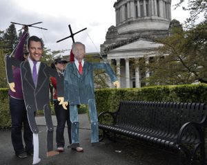 OLYMPIA -- Supporters of NARAL try to send a message to Sens. Joe Fain and Dino Rossi on Thursday, April 20, to support funding for Planned Parenthood and "not be a puppet" to conservative Republicans who are looking to cut it. (Jim Camden/The Spokesman-Review)