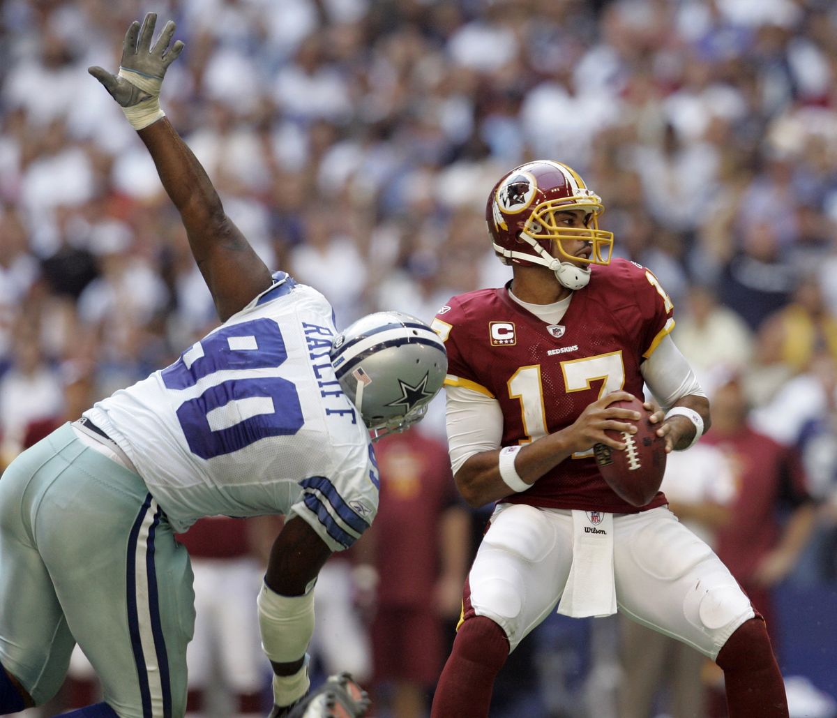 Redskins quarterback Jason Campbell throws under pressure from Dallas’ Jay Ratliff in the second quarter. (Associated Press / The Spokesman-Review)