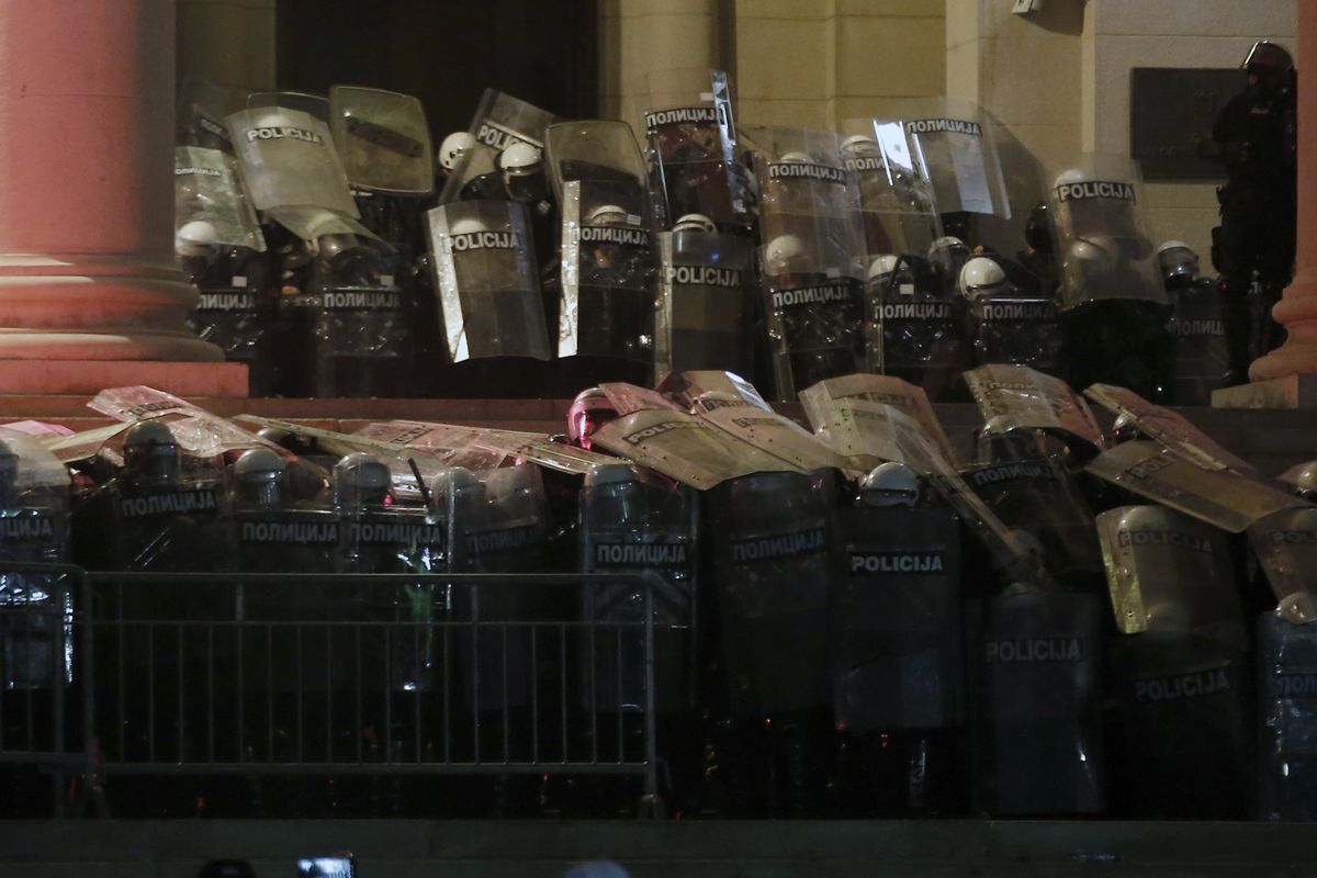 Serbian riot police guard the Serbian parliament building during a protest in Belgrade, Serbia, Friday, July 10 2020. Hundreds of demonstrators tried to storm Serbia